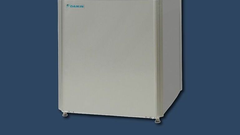 Frittstående innendørs varme- og kjøleenhet fra Daikin i grå metallfinish.